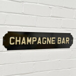 Skylt "Champagne Bar"